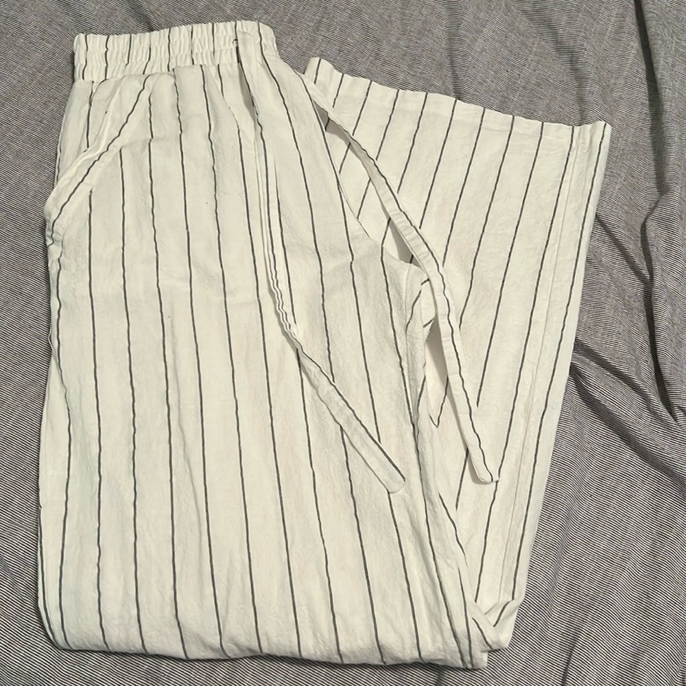 White trousers with black stripes